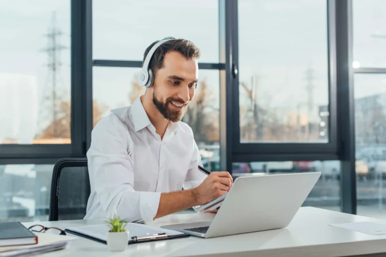 positive-translator-working-online-with-headphones-2022-12-16-20-42-31-utc-min-scaled